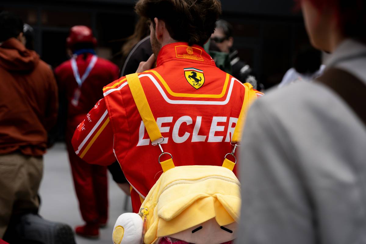 MotoGP rider leather suit with visible Rider Sponsorship Deals logos during pit stop